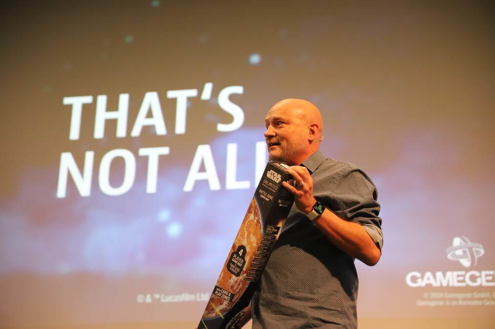 Gamegenic boss Adrian Alonso shows the new Twin Suns mat - but there is more to come. Photo: Volkmann